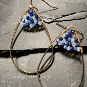 Beautiful gold designer earrings with blue bead accents